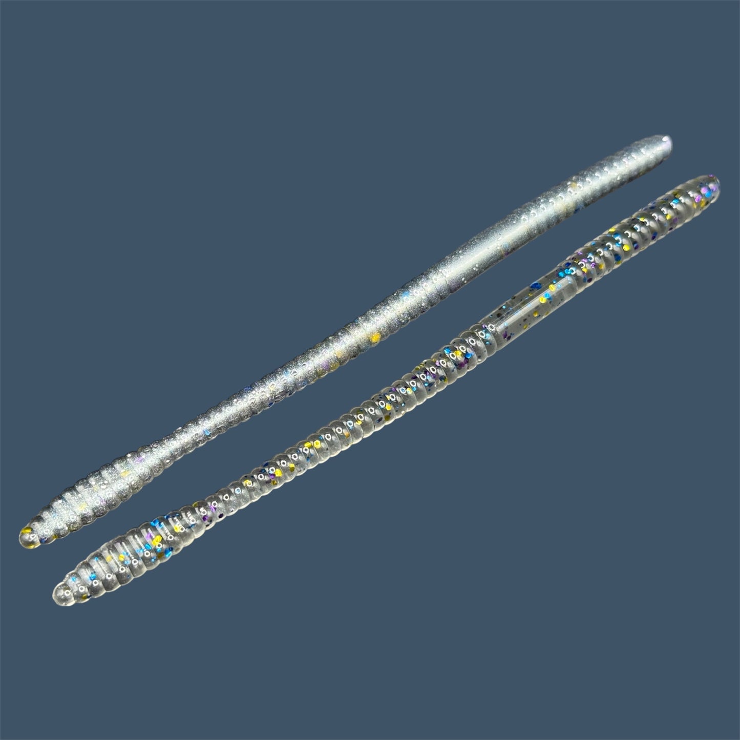 Soft Plastic Trick worm/Straight Tail Worm with flat spade-shaped tail and slender ribbed body. Spade Tail Worm shown in Bait Fish, a proven fish-catching color