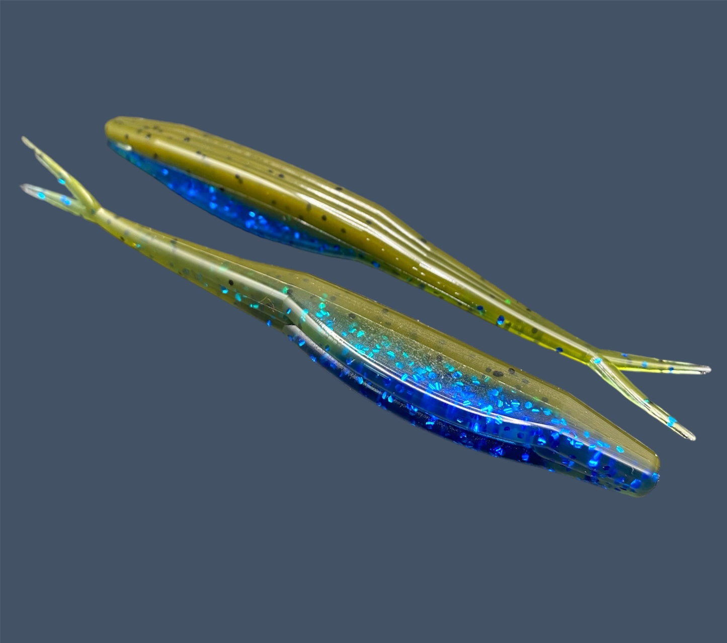 Split Tail Shad soft plastic Fluke style bait with realistic shad appearance, featuring a slotted belly for weedless rigging. Jerkbait in Big "O" (Green Pumpkin with Blue Flake) a proven fish-catching color
