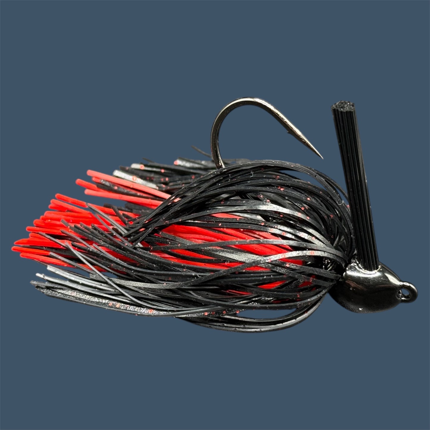 Flipping Jig in Envy (Green Pumpkin), showcasing the aggressive angled heads, Mustad Hook and fiber weed guards for effective fishing in diverse conditions.