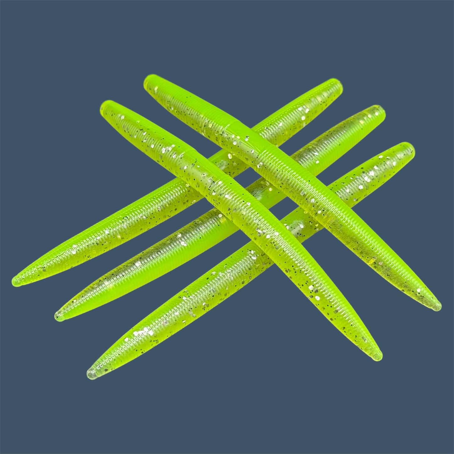 Boomstick is a senko-style stickbait for flipping, skipping, and casting, displayed in Chartreuse Shad for different fishing conditions in freshwater fishing. Great addition to any anglers tackle box