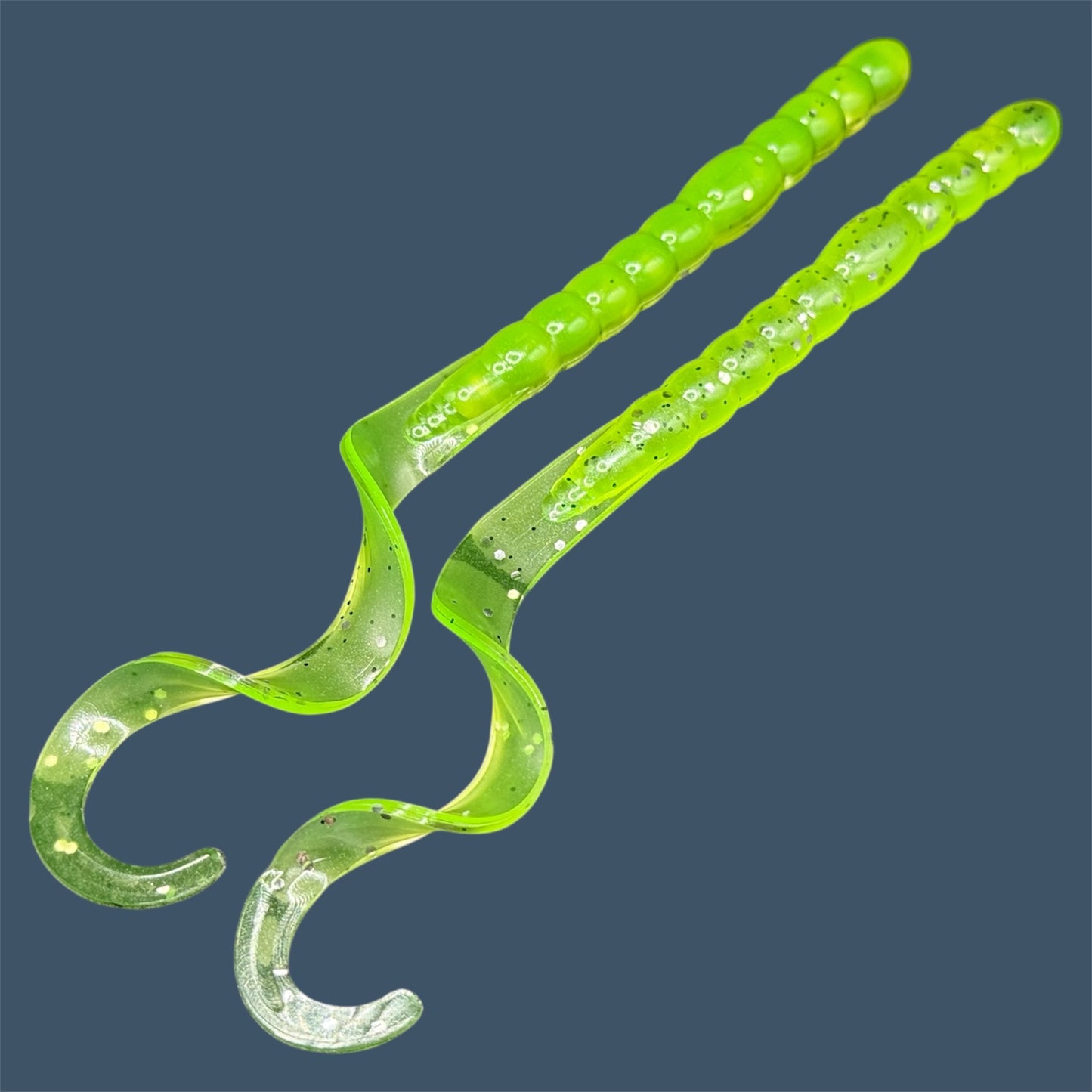 Soft plastic curly/ribbon tail worm 7.5-inch with realistic movement and versatile design for Texas and Carolina rigs. 7.5" Curl Tail Worm shown in Chartreuse Shad