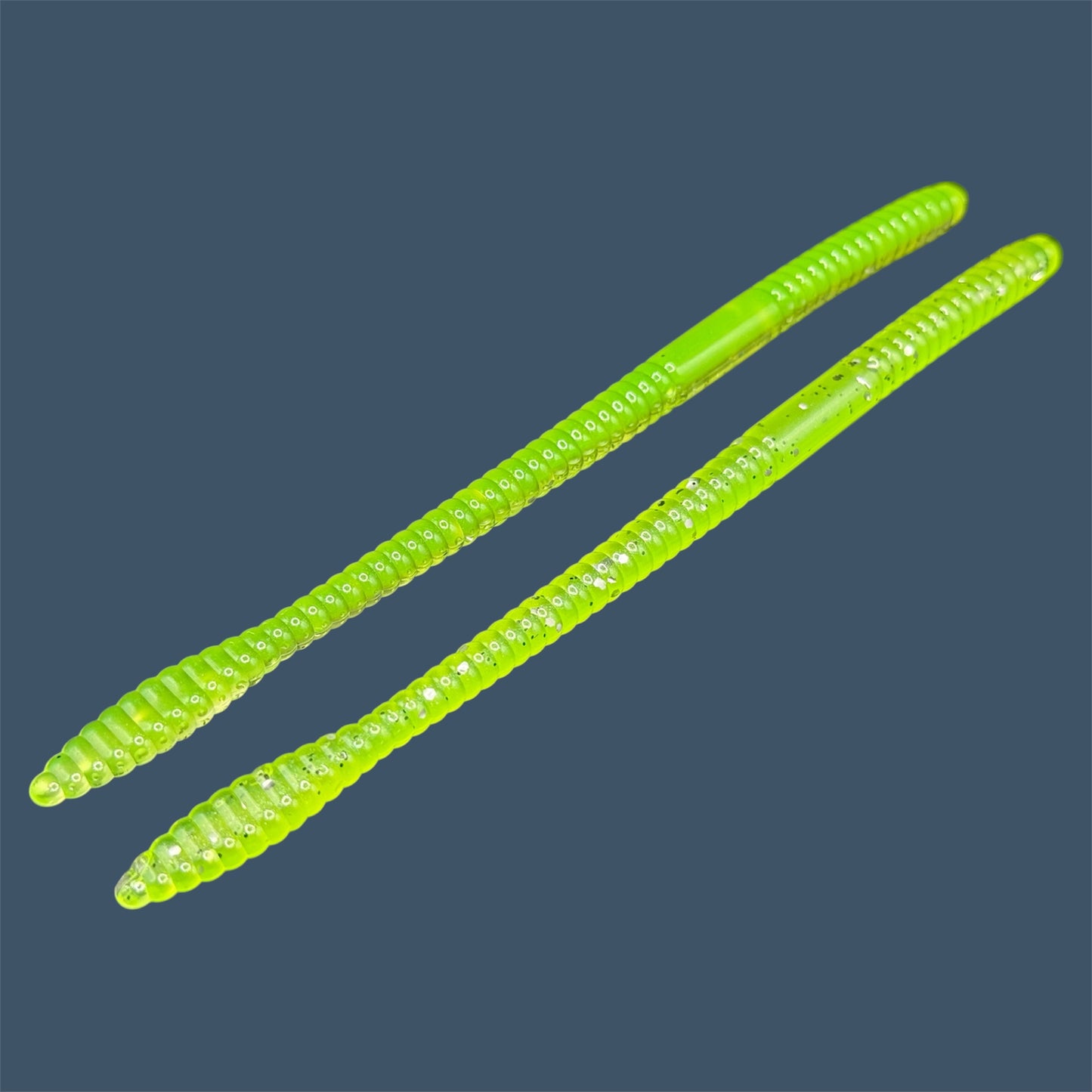 Soft Plastic Trick worm/Straight Tail Worm with flat spade-shaped tail and slender ribbed body. Spade Tail Worm in the color Chartreuse Shad, a proven fish-catching color