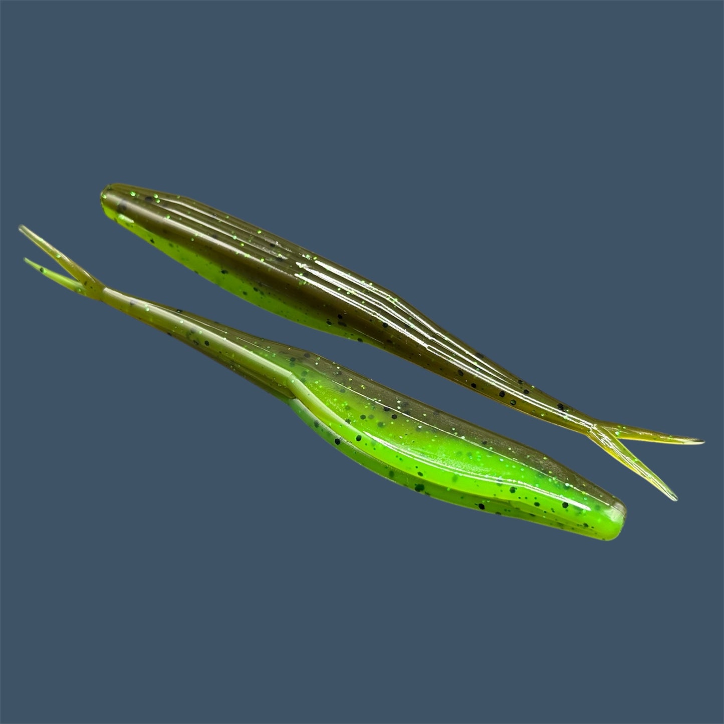 Split Tail Shad soft plastic Fluke style bait with realistic shad appearance, featuring a slotted belly for weedless rigging. Jerkbait in Envy (Green Pumpkin over Green) a proven fish-catching color