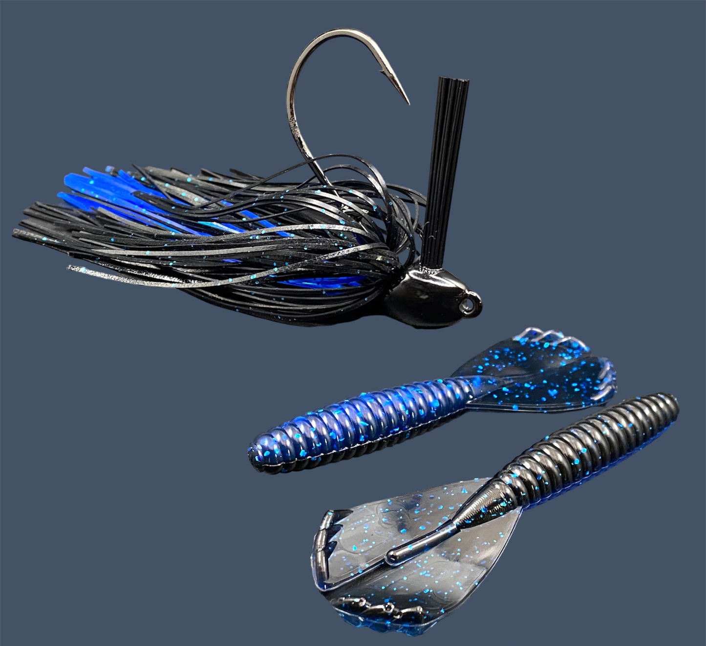 Fishing lure bundle with a high-quality jig and soft plastic bait, perfect for bass fishing with a variety of soft plastic lures. Shown here in color Black Sapphire (Black over blue flake) is a hand tied black flipping jig paired with Big League Bait Grub 3.5"