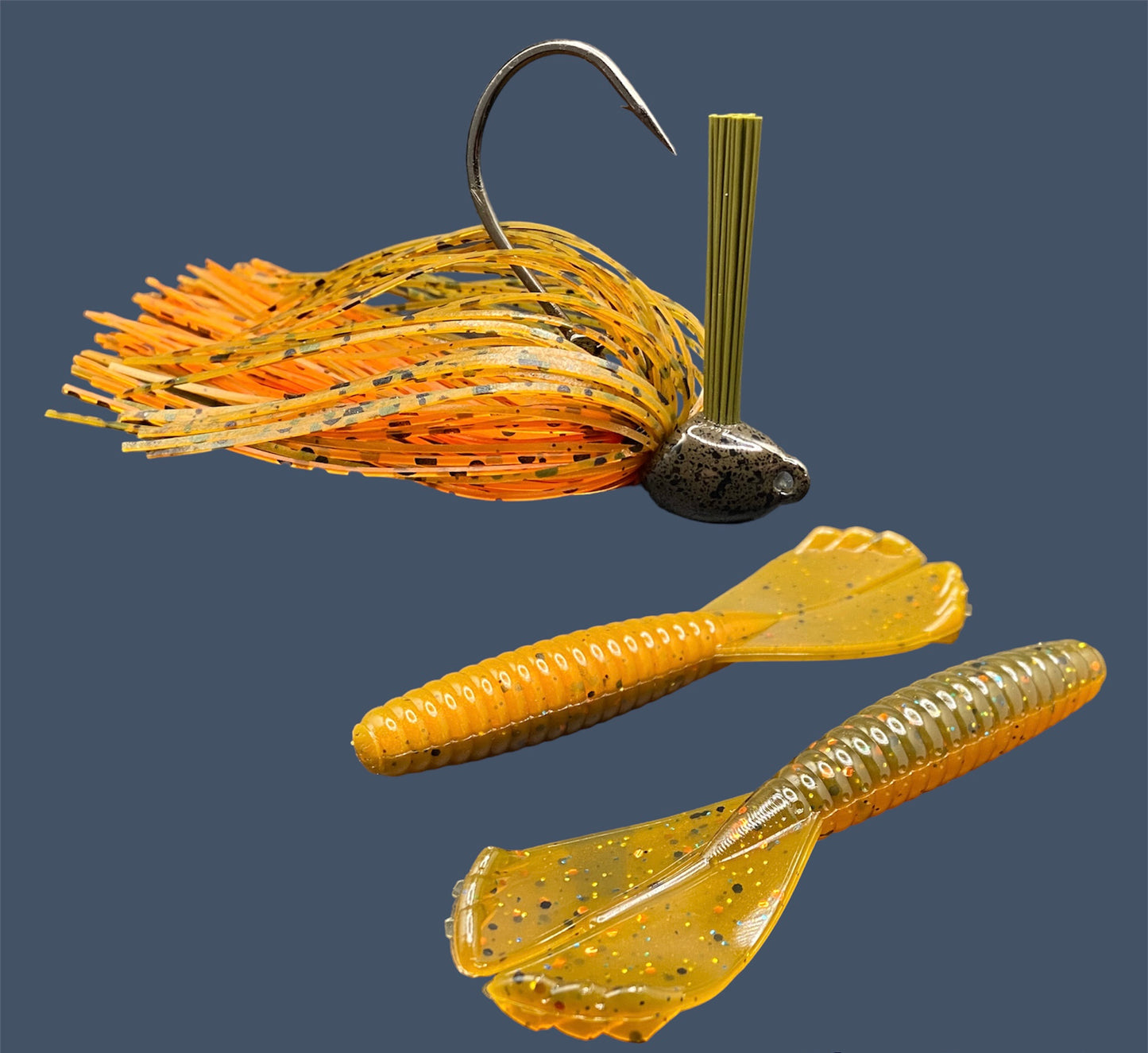 Fishing lure bundle with a high-quality jig and soft plastic bait, perfect for bass fishing with a variety of soft plastic lures. Shown here in color Pumpkin Spice (Green Pumpkin over Orange) is a hand tied green pumpkin flipping jig paired with Big League Bait Grub 3.5"