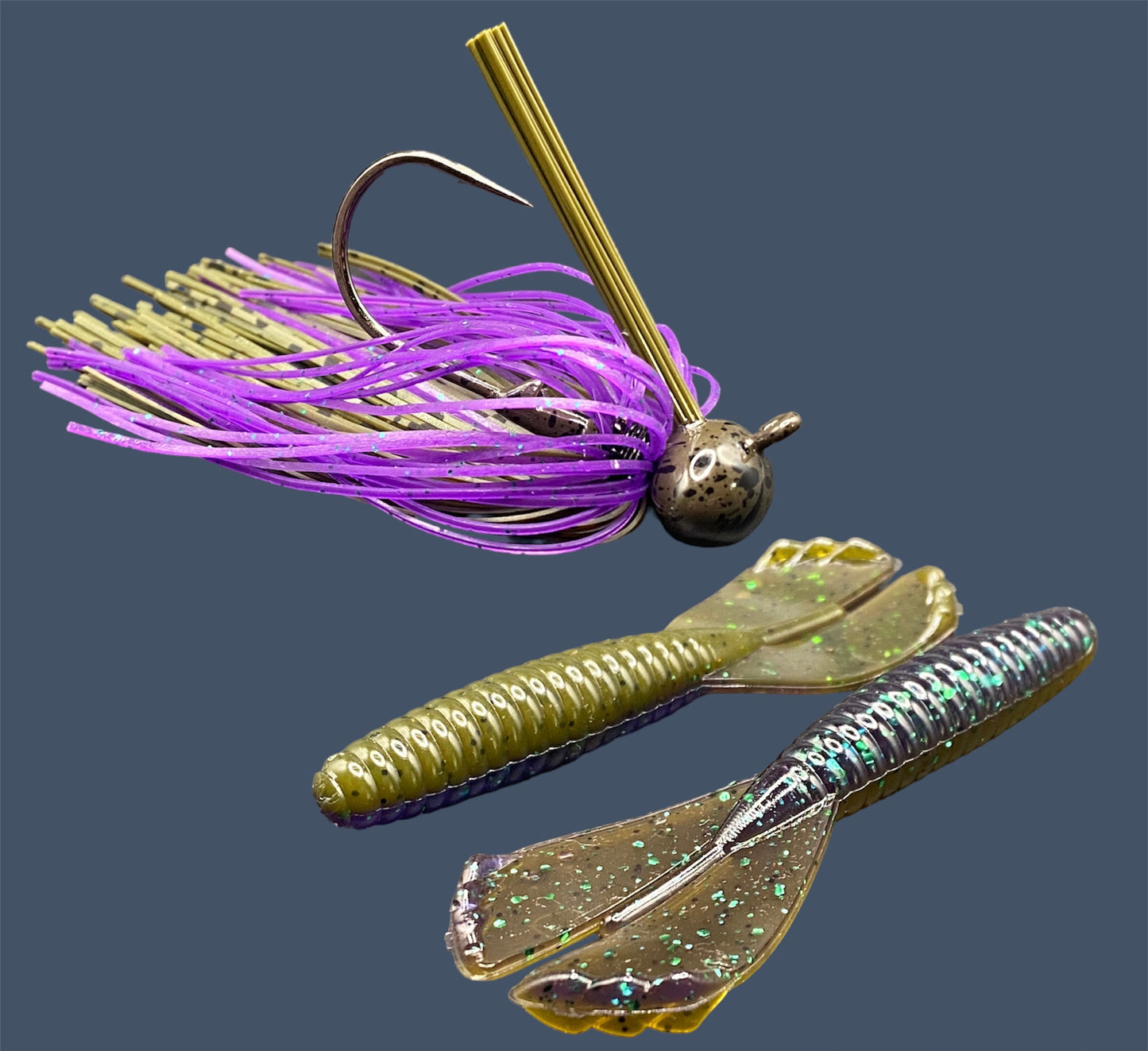 Fishing lure bundle with a high-quality jig and soft plastic bait, perfect for bass fishing with a variety of soft plastic lures. Shown here in color Swamp Juice (Purple over Green Pumpkin) is a hand tied green pumpkin football jig paired with Big League Bait Grub 3.5"