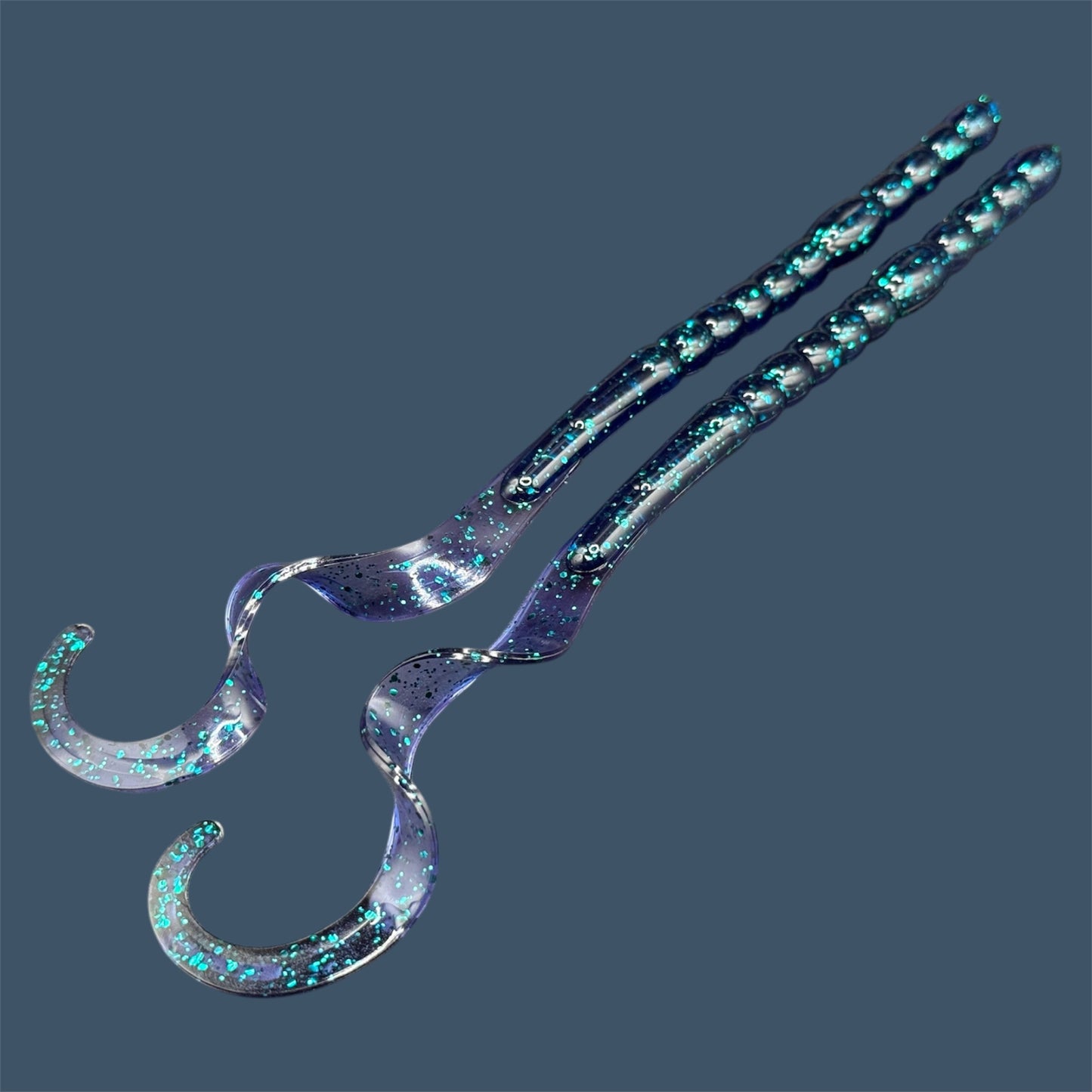 Large curly/ribbon tail worm 10" with a realistic curl tail, ideal for Texas and Carolina rigging. 10" Curl Tail Worm shown in Junebug