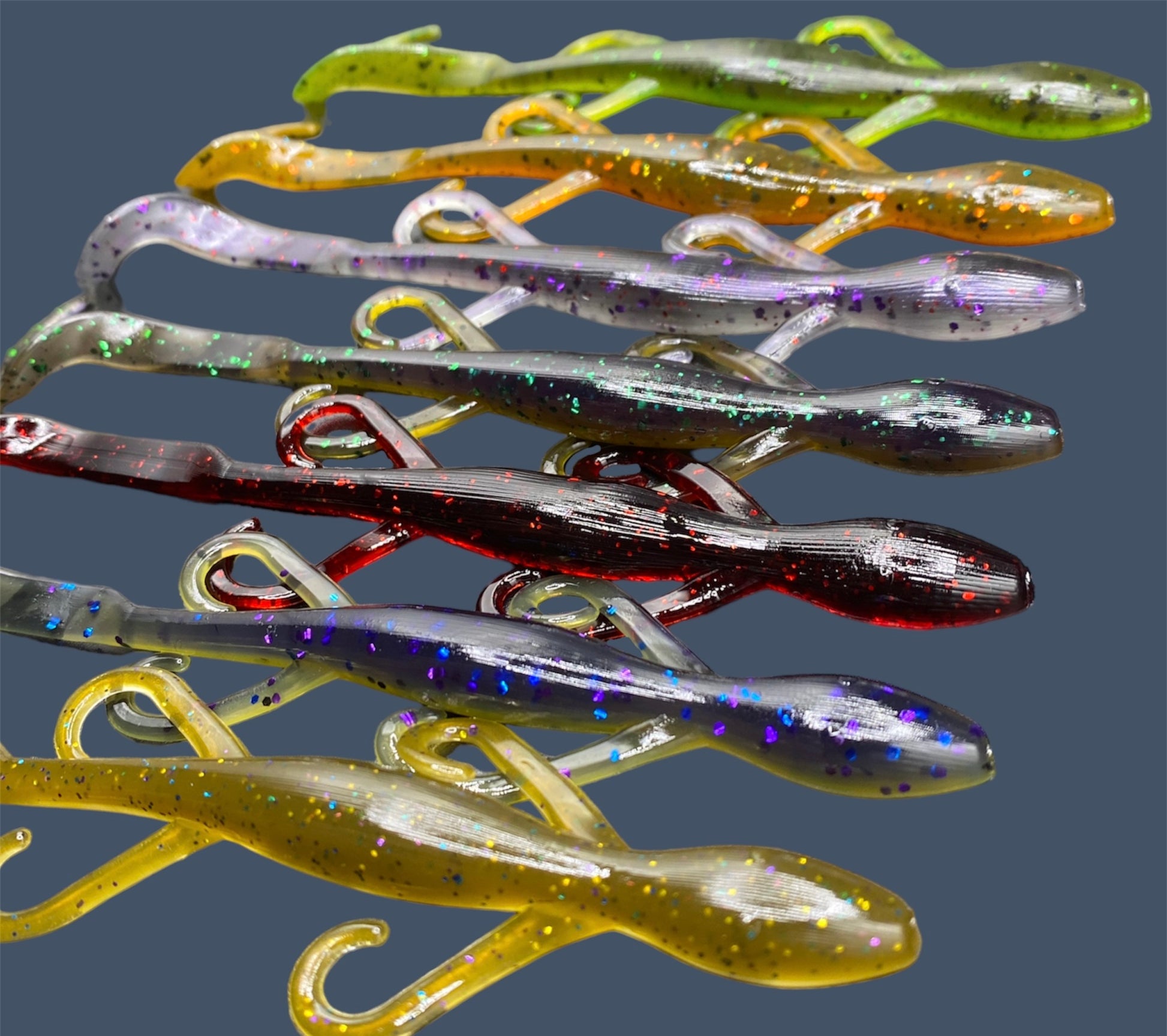 Lizard creature bait with sleek body, free-flowing appendages, and curl tail, ideal for Texas and Carolina rigs, shown in a variety of proven fish-catching colors