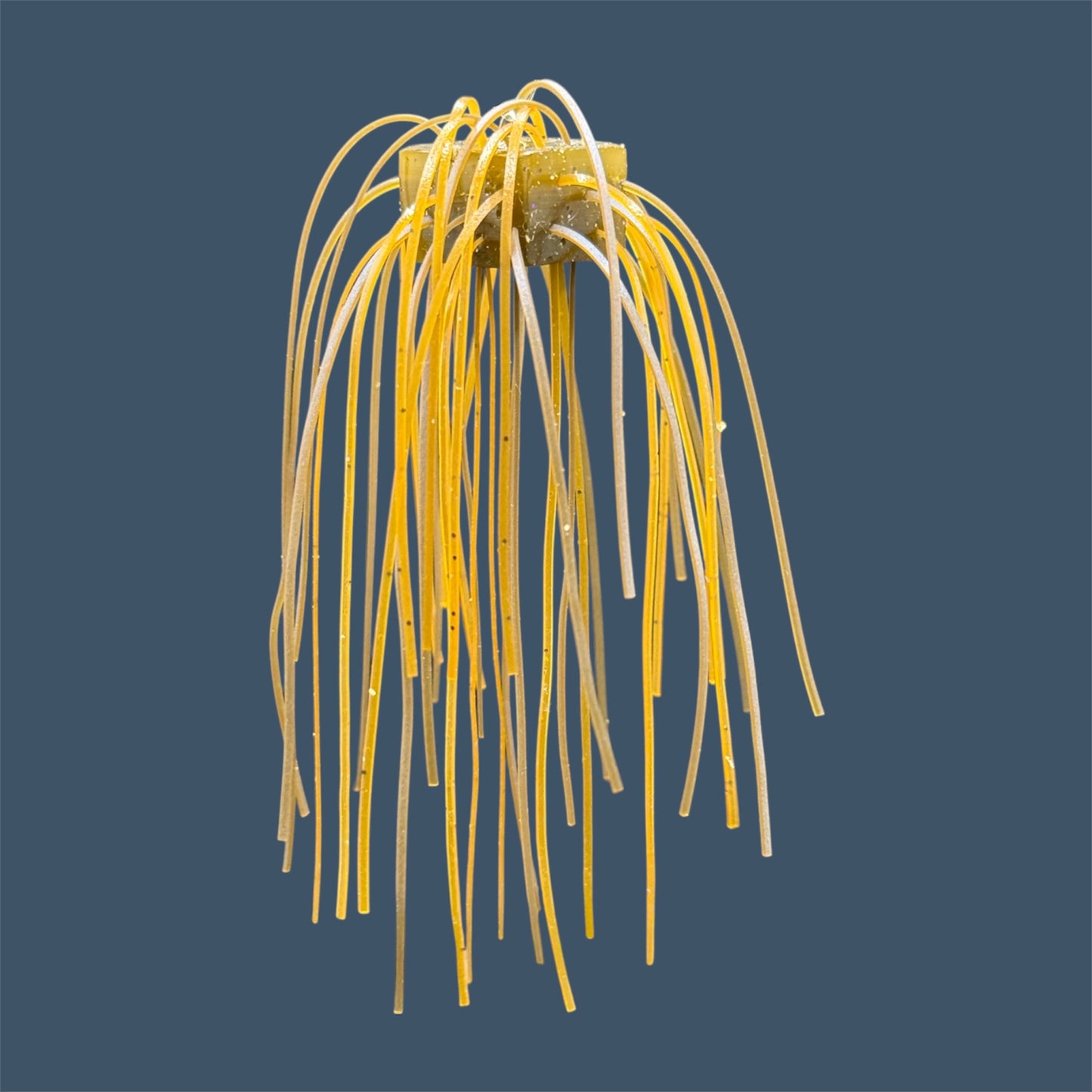 Skirted Cube Fuzzy Dice-style soft plastic bass lure, threaded with lifelike skirt material, perfect for drop shot and wacky rig finesse fishing.Shown in Magic Craw