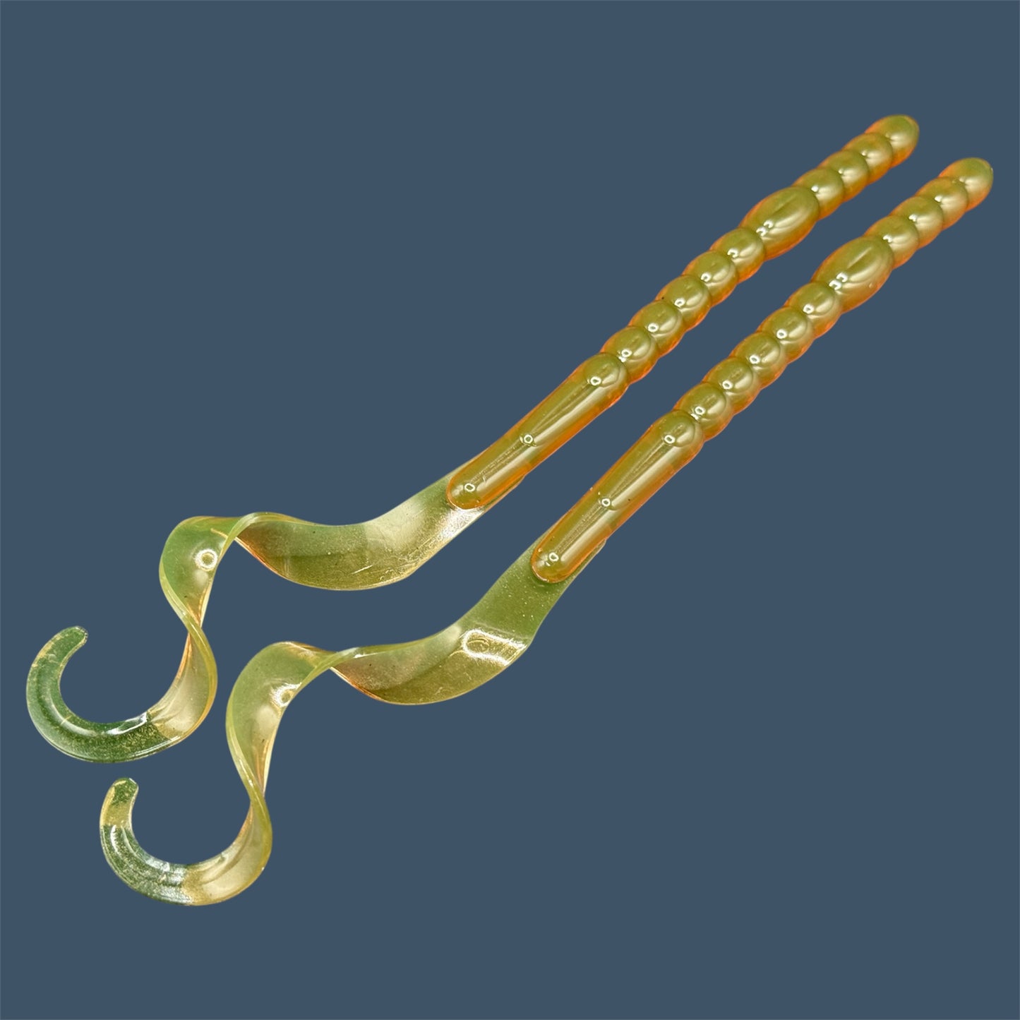 Large curly/ribbon tail worm 10" with a realistic curl tail, ideal for Texas and Carolina rigging. 10" Curl Tail Worm shown in Motor Oil