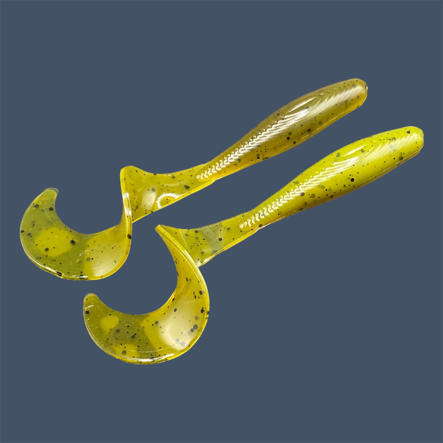 Single Tail Grub with a thick curl tail for strong water displacement, shown in Ol' Skool a proven fish-catching color suitable for both freshwater fishing and inshore saltwater fishing