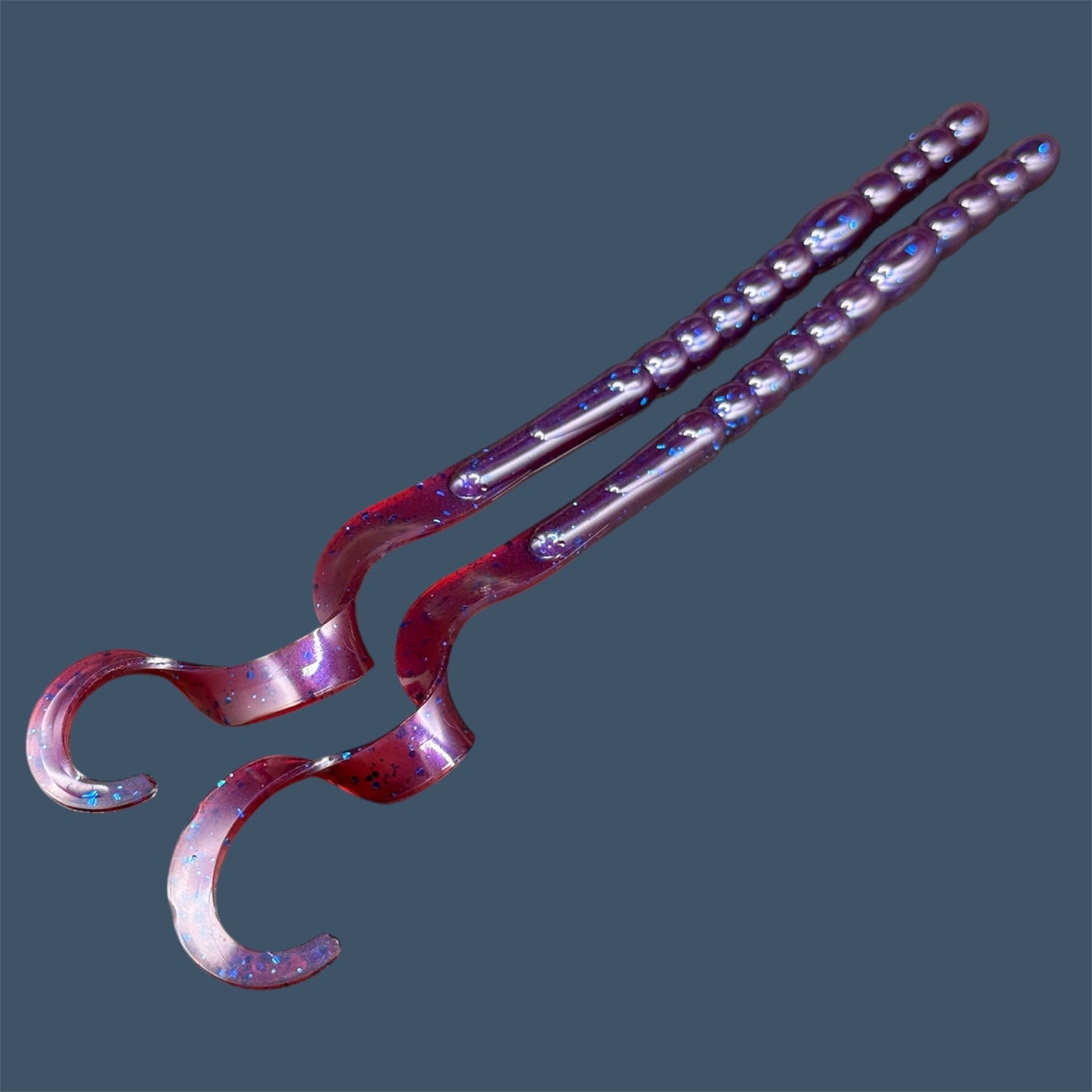 Large curly/ribbon tail worm 10" with a realistic curl tail, ideal for Texas and Carolina rigging. 10" Curl Tail Worm shown in Plum Pearl