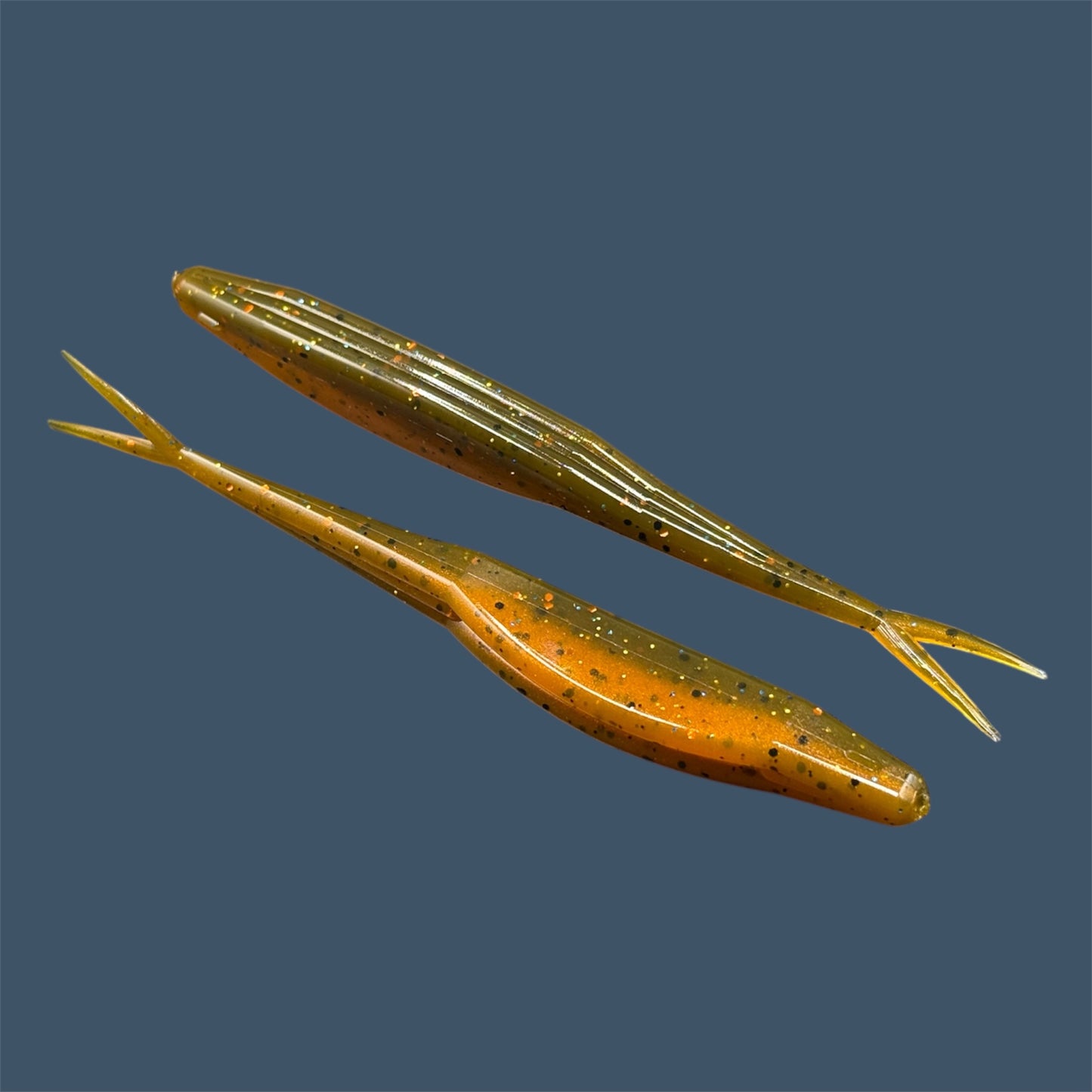 Split Tail Shad soft plastic Fluke style bait with realistic shad appearance, featuring a slotted belly for weedless rigging. Jerkbait in Pumpkin Spice a proven fish-catching color