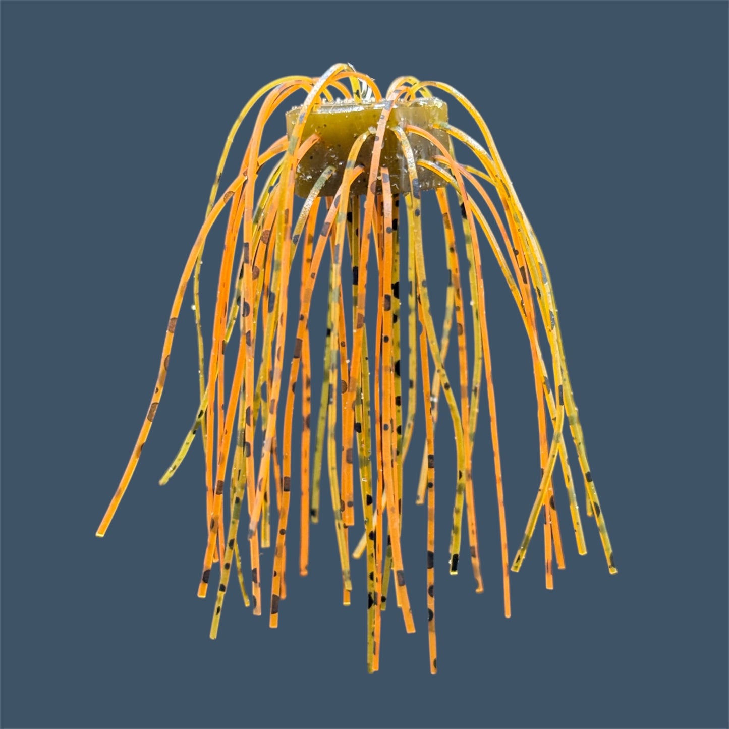 Skirted Cube Fuzzy Dice-style soft plastic bass lure, threaded with lifelike skirt material, perfect for drop shot and wacky rig finesse fishing.Shown in Pumpkin Spice