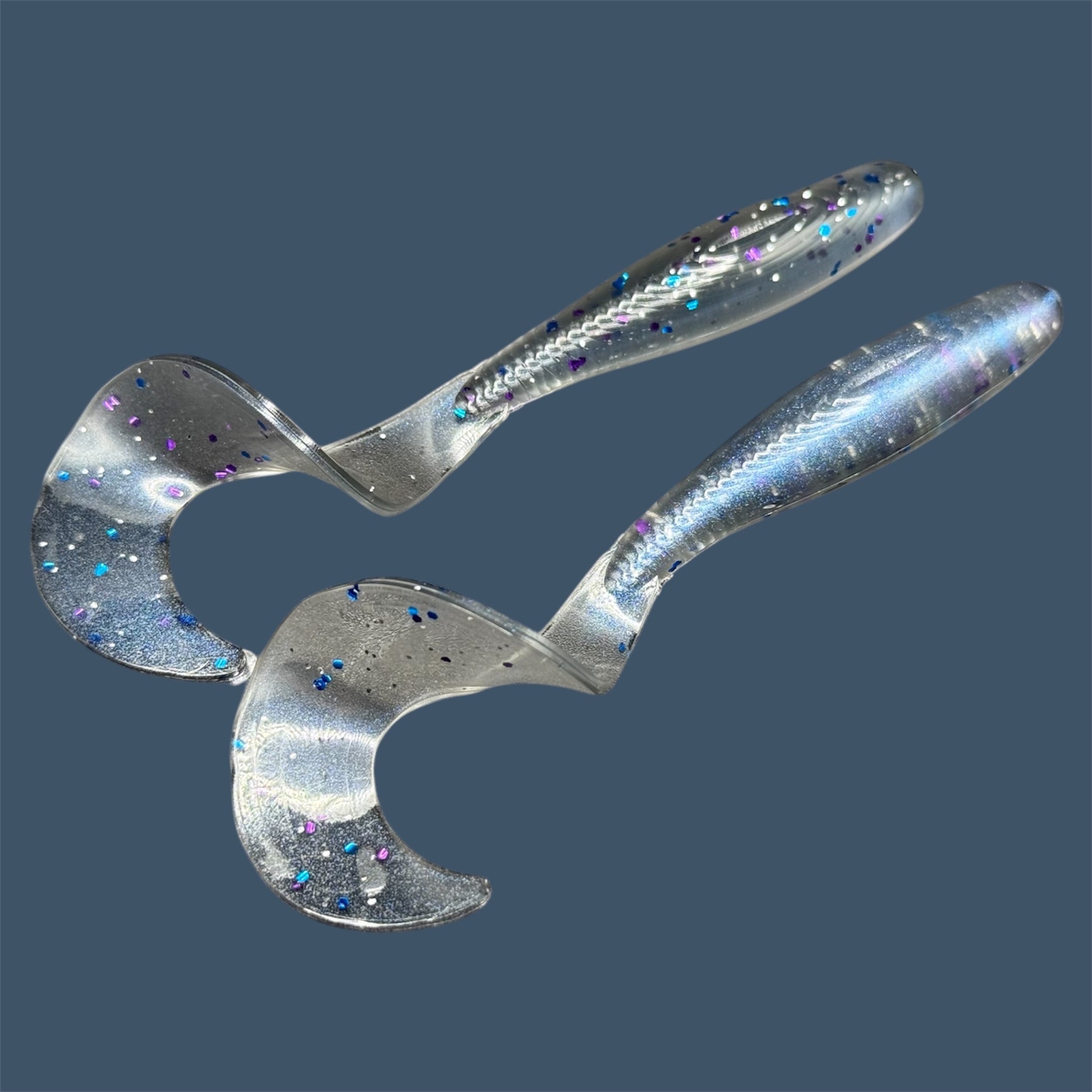 Single Tail Grub with a thick curl tail for strong water displacement, shown in Smoke Show a proven fish-catching color suitable for both freshwater fishing and inshore saltwater fishing