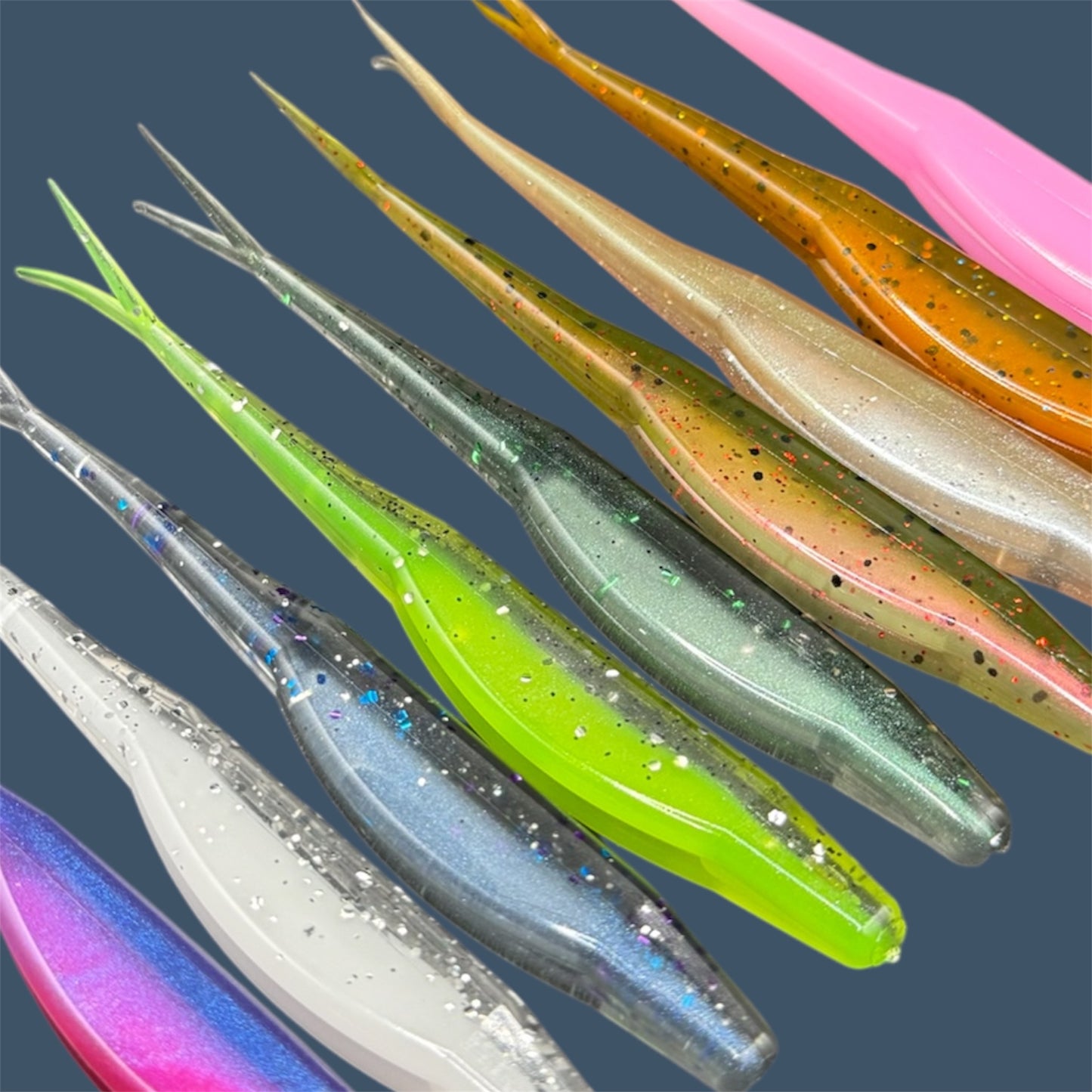 Split Tail Shad soft plastic Fluke style bait with realistic shad appearance, featuring a slotted belly for weedless rigging. Jerkbait shown in a variety of proven fish-catching color