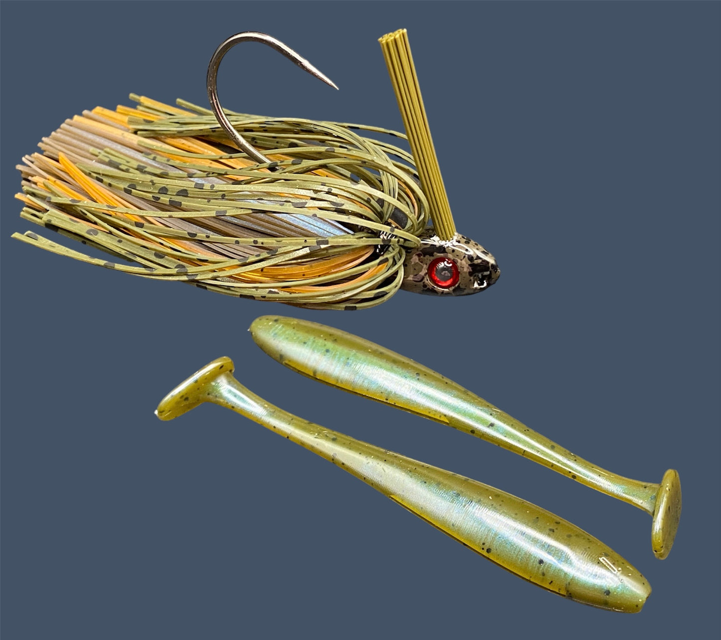 Fishing lure bundle with a high-quality jig and soft plastic bait, perfect for freshwater and saltwater fishing with a variety of soft plastic lures. Shown here in color Magic Craw (Green Pumpkin and Blue) is a hand tied Green Pumpkin swim jig paired with Big League Bait Pro Swim (Swim bait style soft plastic lure)