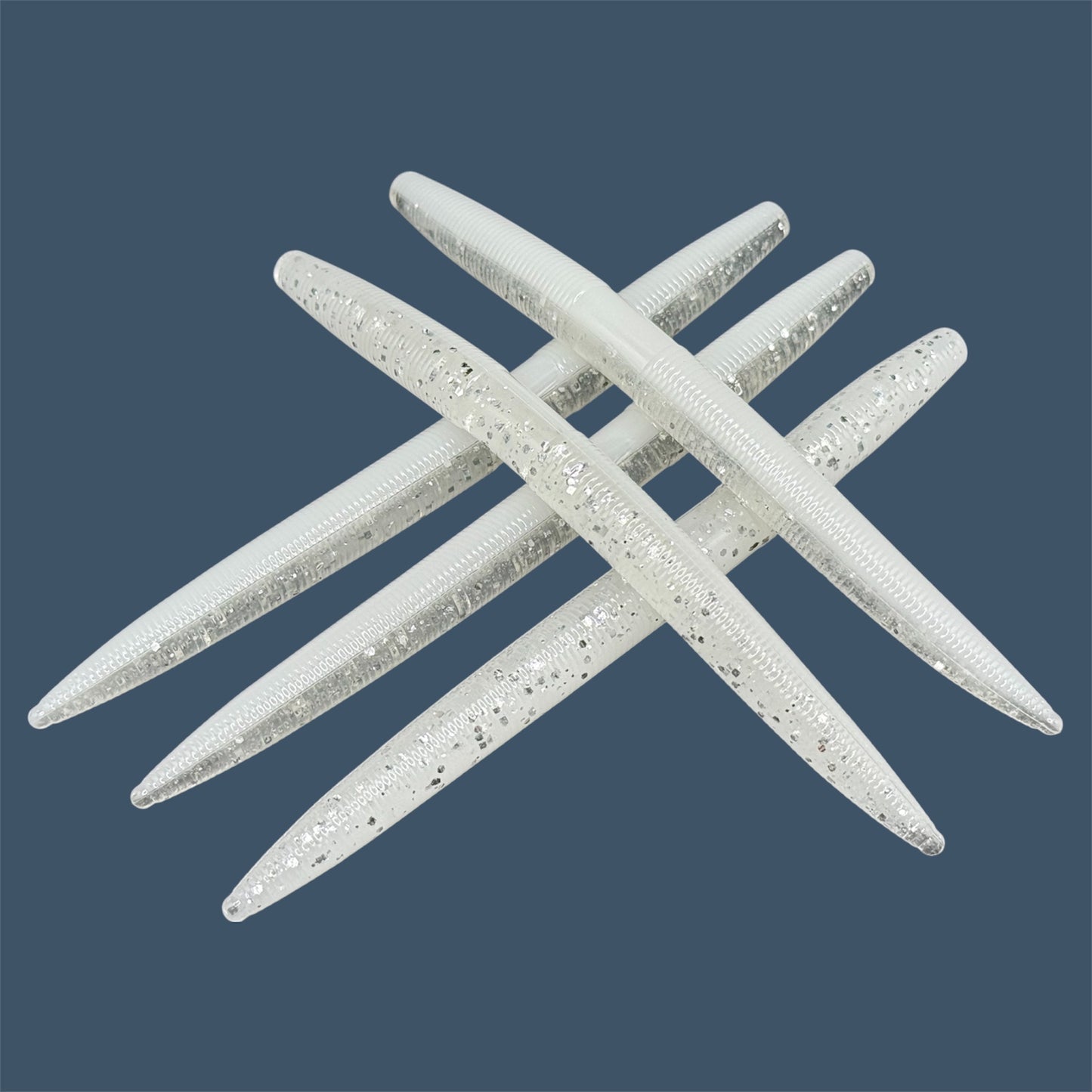 Boomstick is a senko-style stickbait for flipping, skipping, and casting, displayed in White Ice for different fishing conditions in freshwater fishing. Great addition to any anglers tackle box