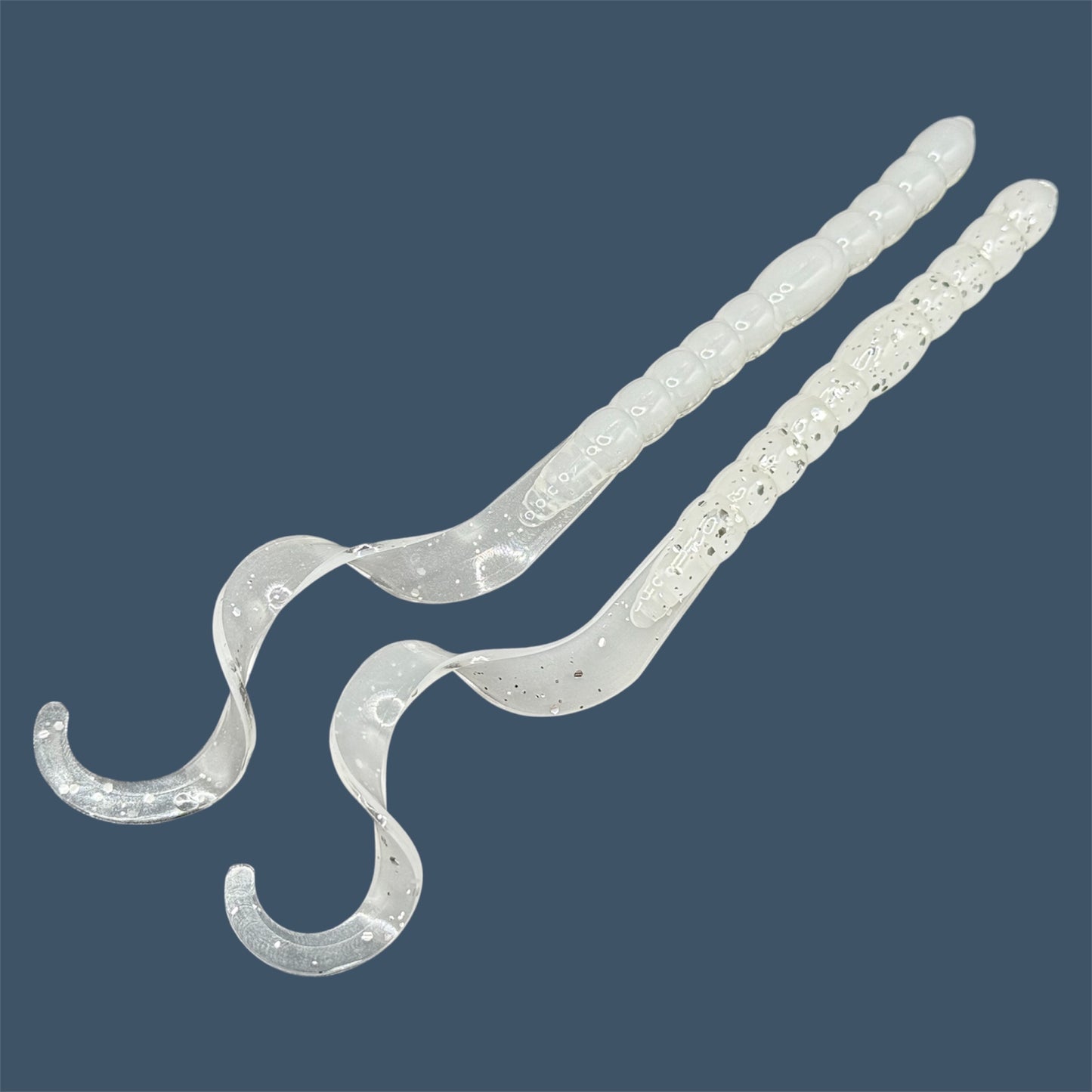 Soft plastic curly/ribbon tail worm 7.5-inch with realistic movement and versatile design for Texas and Carolina rigs. 7.5" Curl Tail Worm shown in White Ice
