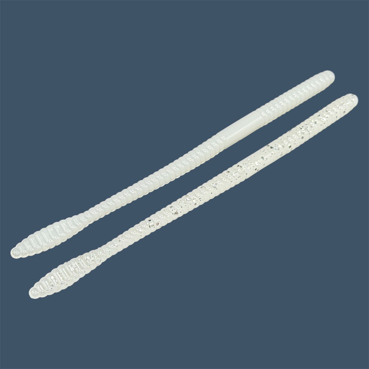 Soft Plastic Trick worm/Straight Tail Worm with flat spade-shaped tail and slender ribbed body. Spade Tail Worm in the color White Ice, a proven fish-catching color