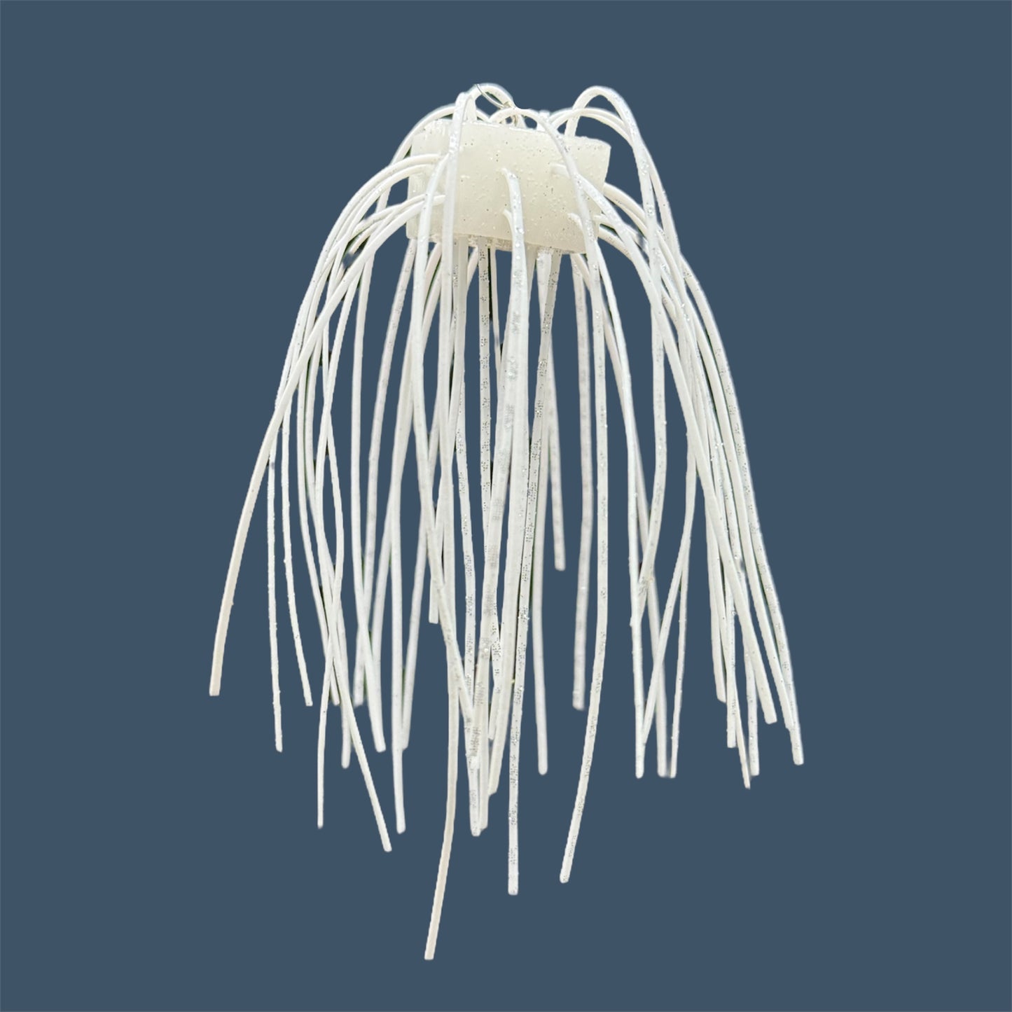 Skirted Cube Fuzzy Dice-style soft plastic bass lure, threaded with lifelike skirt material, perfect for drop shot and wacky rig finesse fishing.Shown in White Ice