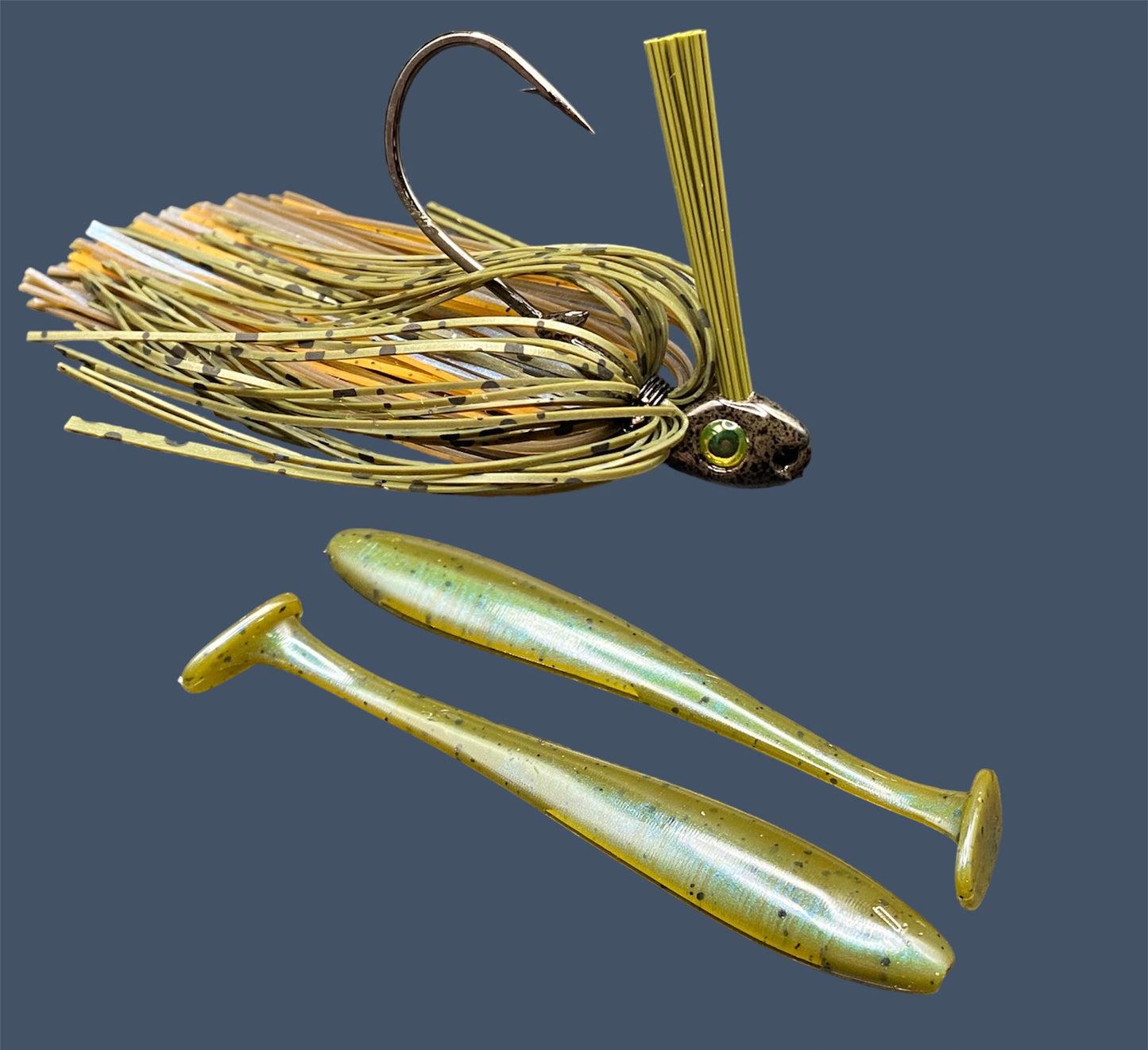 Fishing lure bundle with a high-quality jig and soft plastic bait, perfect for freshwater and saltwater fishing with a variety of soft plastic lures. Shown here in color Magic Craw (Green Pumpkin and Blue) is a hand tied Green Pumpkin swim jig paired with Big League Bait Pro Swim (Swim bait style soft plastic lure)