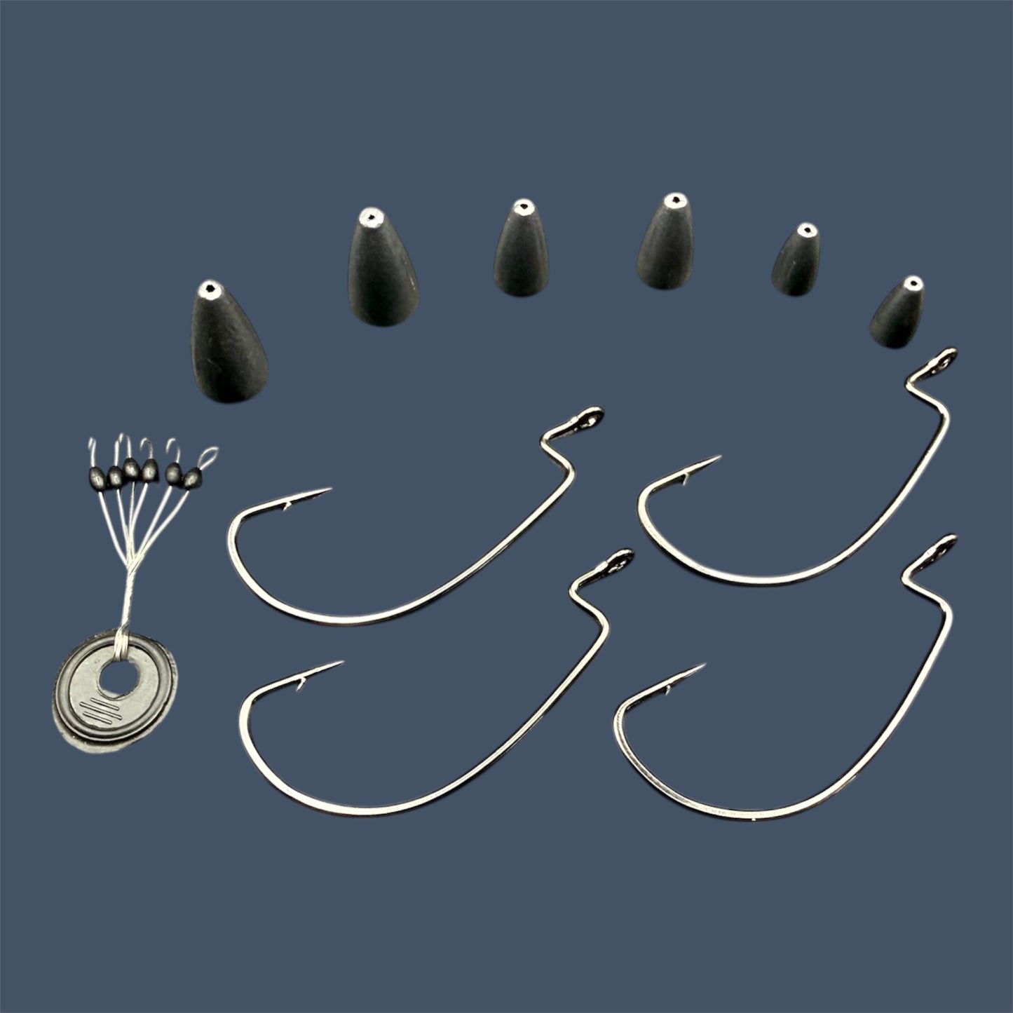 Close-up image of the Texas Rig Kit showing Eagle Claw®️ Size 5/0 EWG Hooks, Bullet Weights in various sizes and Weight Stops