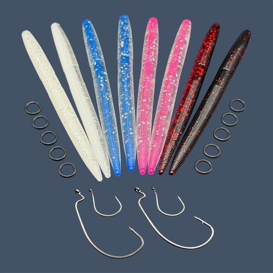 Big League Bait Company Boombox this kit is pictured with several bags of soft plastic fishing lures. All of the soft plastic baits are Big League Bait Company's Boomstick. A senko style stick worm with Wacky Rig O-rings, Eagle Claw EWG 4/0 Hooks and Wacky Rig hooks. Shown in 4 colors (left to right) White Ice, Black Cherry, Side Chick (Core Shot Stick Back), and Sugar Daddy (Core Shot Stick Bait)