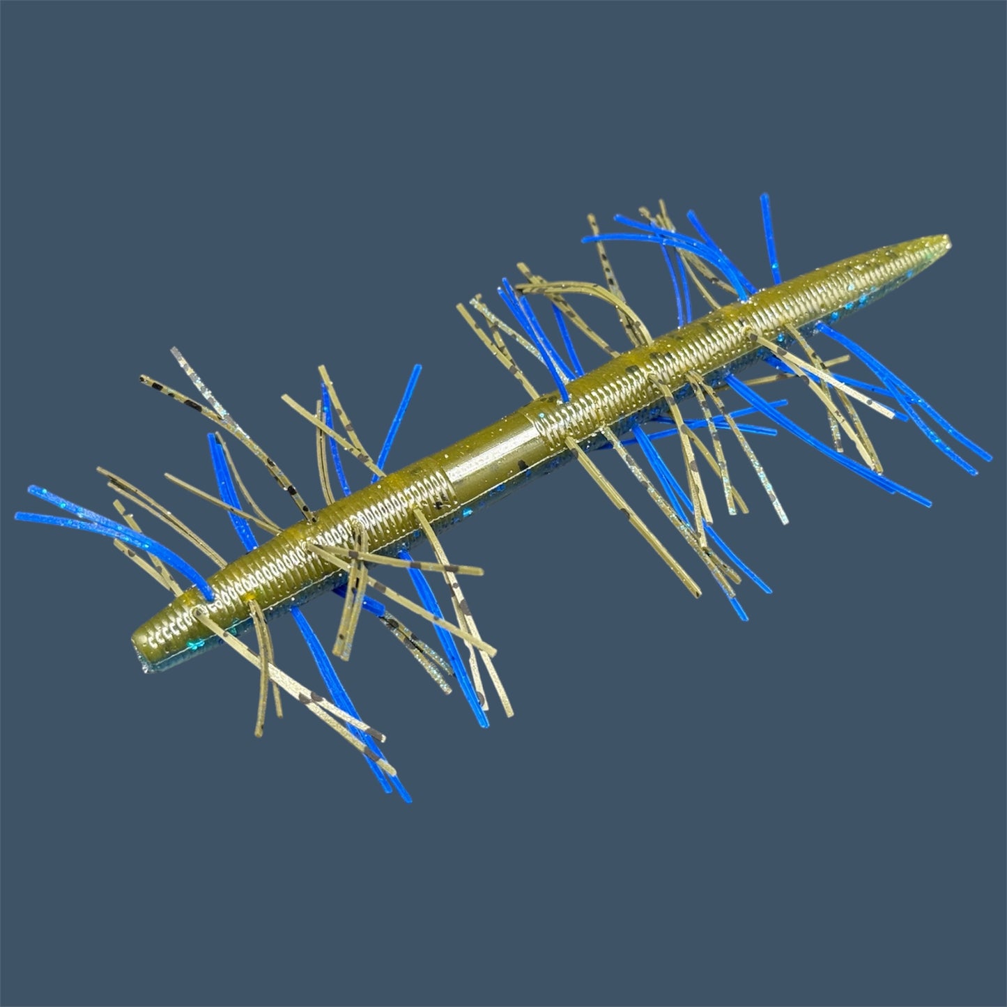 Fuzzy Boomstick Soft Plastic Bait (Stick worm style bait) with embedded skirt material for Fishing. Shown in Big "O" (Blue and green pumpkin) Fuzzy Soft Plastic Lure