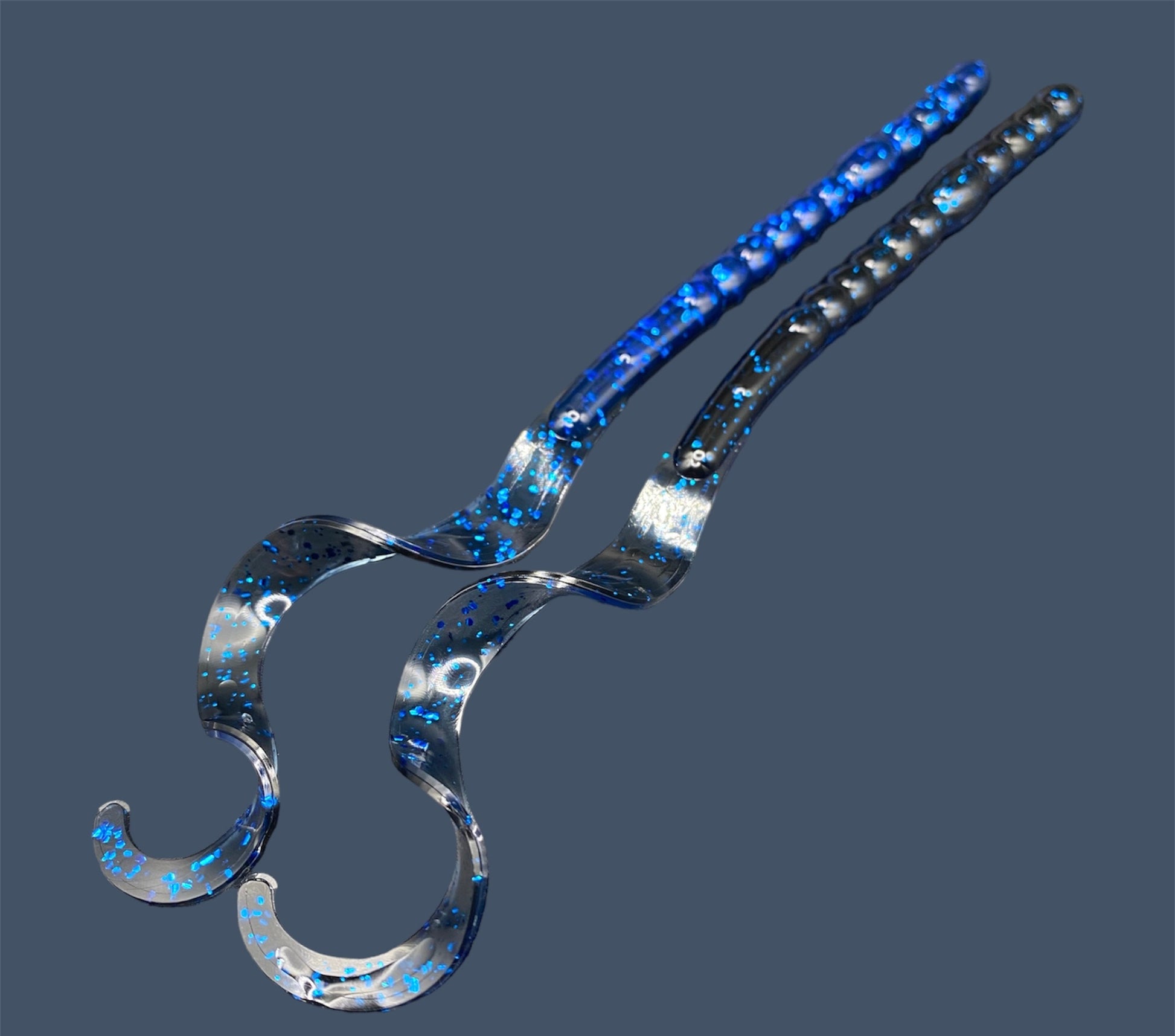 Large curly/ribbon tail worm 10" with a realistic curl tail, ideal for Texas and Carolina rigging. 10" Curl Tail Worm shown in Black Sapphire (Black and Blue)