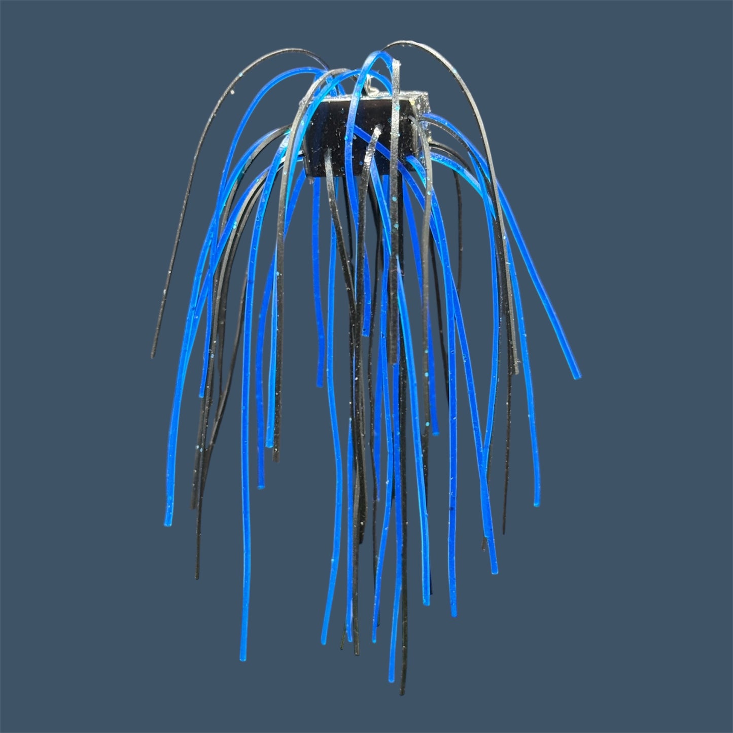 Skirted Cube Fuzzy Dice-style soft plastic bass lure, threaded with lifelike skirt material, perfect for drop shot and wacky rig finesse fishing.Shown in Black Sapphire