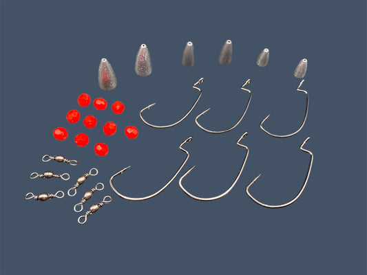 Close-up image of the Carolina Rig Kit showing Eagle Claw®️ Size 3/0 & 4/0 EWG Hooks, Bullet Weights in various sizes, Barrel Swivels and Fishing Beads