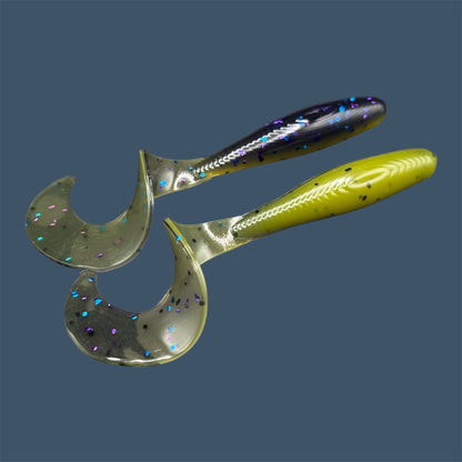 Single Tail Grub with a thick curl tail for strong water displacement, shown in Luau a proven fish-catching color suitable for both freshwater fishing and inshore saltwater fishing. (Purple over Banana Seed)