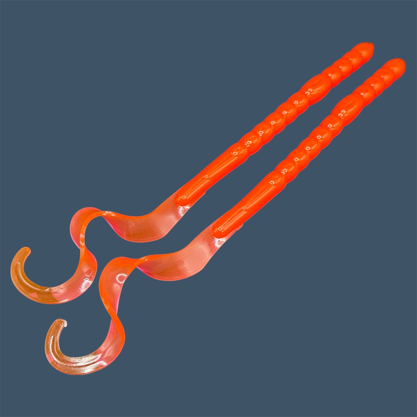 Large curly/ribbon tail worm 10" with a realistic curl tail, ideal for Texas and Carolina rigging. 10" Curl Tail Worm shown in Merthiolate
