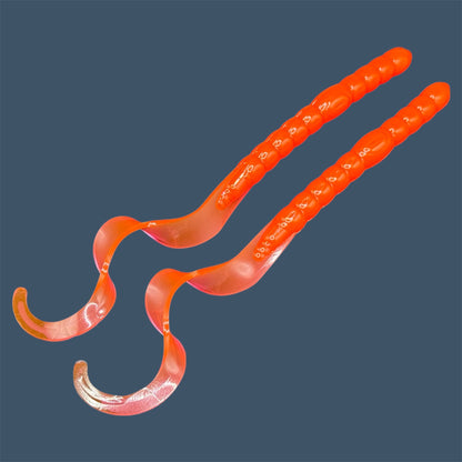 Soft plastic curly/ribbon tail worm 7.5-inch with realistic movement and versatile design for Texas and Carolina rigs. 7.5" Curl Tail Worm shown in Merthiolate