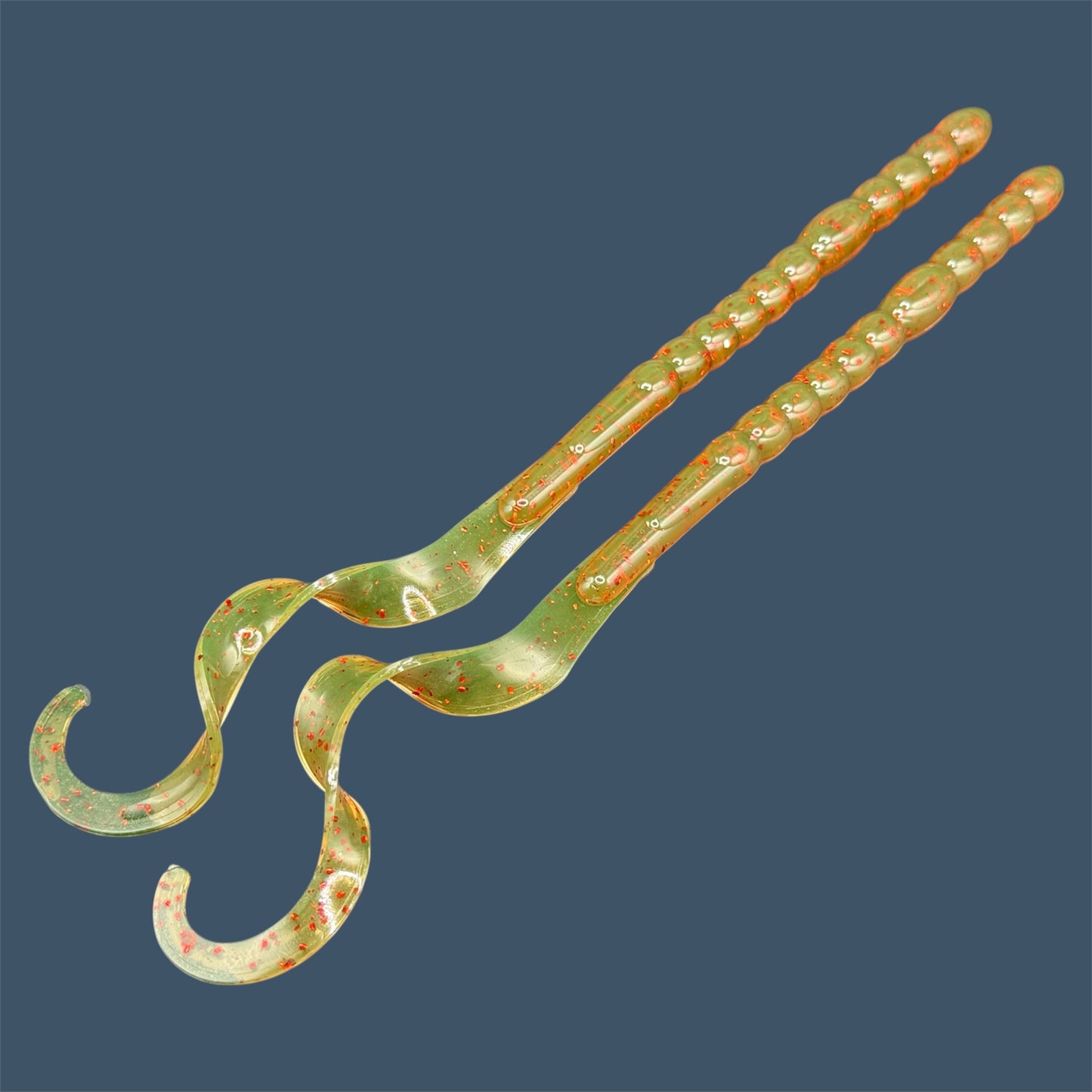 Large curly/ribbon tail worm 10" with a realistic curl tail, ideal for Texas and Carolina rigging. 10" Curl Tail Worm shown in Motor Oil Red