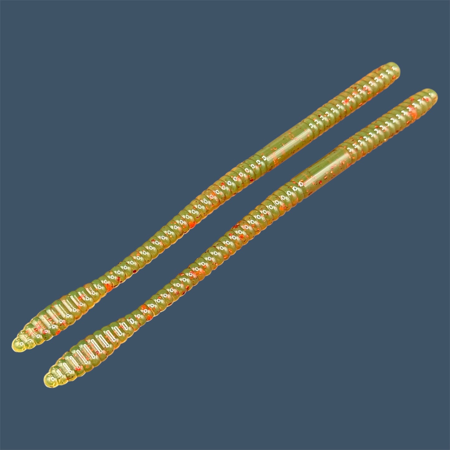 Soft Plastic Trick worm/Straight Tail Worm with flat spade-shaped tail and slender ribbed body. Spade Tail Worm in the color Motor Oil Red, a proven fish-catching color