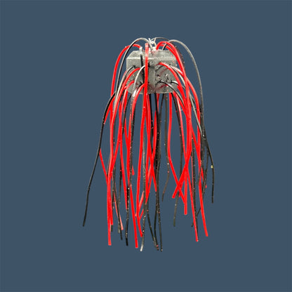 Skirted Cube Fuzzy Dice-style soft plastic bass lure, threaded with lifelike skirt material, perfect for drop shot and wacky rig finesse fishing.Shown in Black Cherry (Black and Red)