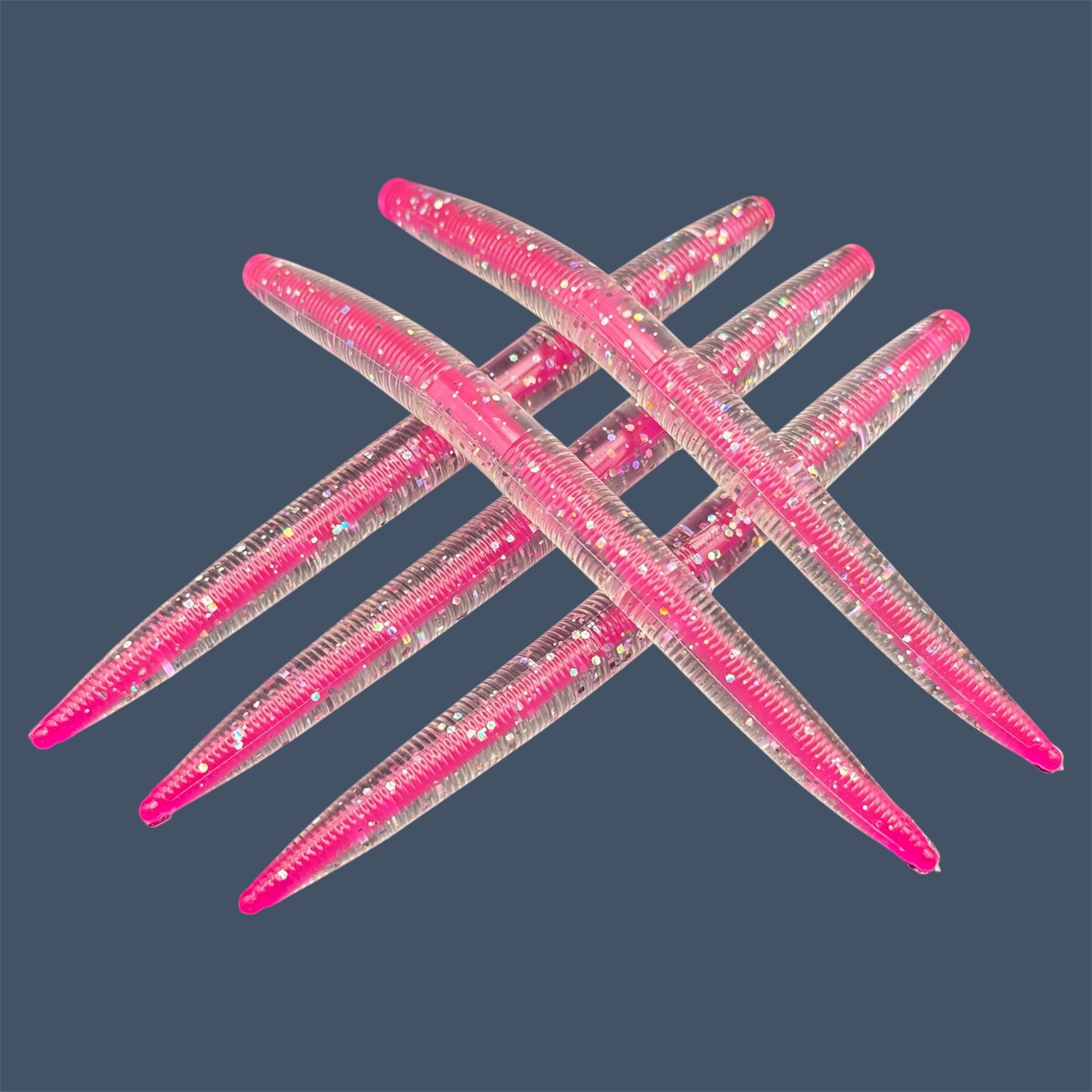 Side Chick Corked Boomstick, core shot stick baits in bold colorways of Clear outer shell with holographic flake and Hot Pink core, soft plastic lures bass fishing from Big League Bait Company. 