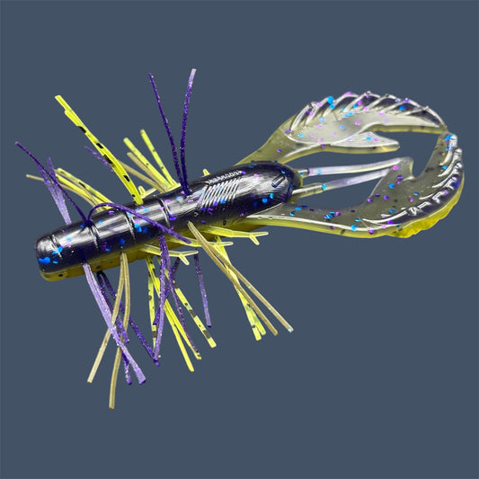 Skirted Commotion Craw 4 inch soft plastic craw with hand-threaded silicone skirt. Shown in the color Luau (Purple over Banana seed)