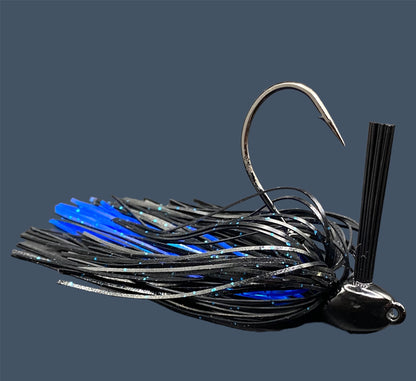 Flipping Jig in Black and Blue, showcasing the aggressive angled heads, Mustad Hook and fiber weed guards for effective fishing in diverse conditions.