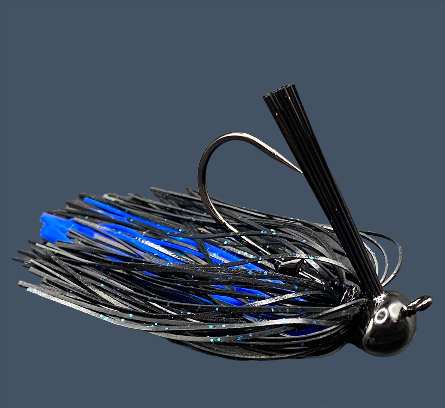 Football Jigs in Black and Blue, highlighting the robust Mustad Heavy Wire hooks, integrated plastics keepers, and flaring 100% silicone skirts.