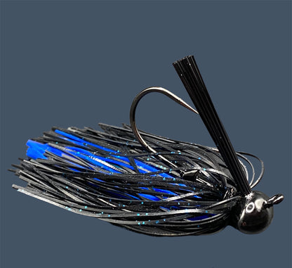 Football Jigs in Black and Blue, highlighting the robust Mustad Heavy Wire hooks, integrated plastics keepers, and flaring 100% silicone skirts.