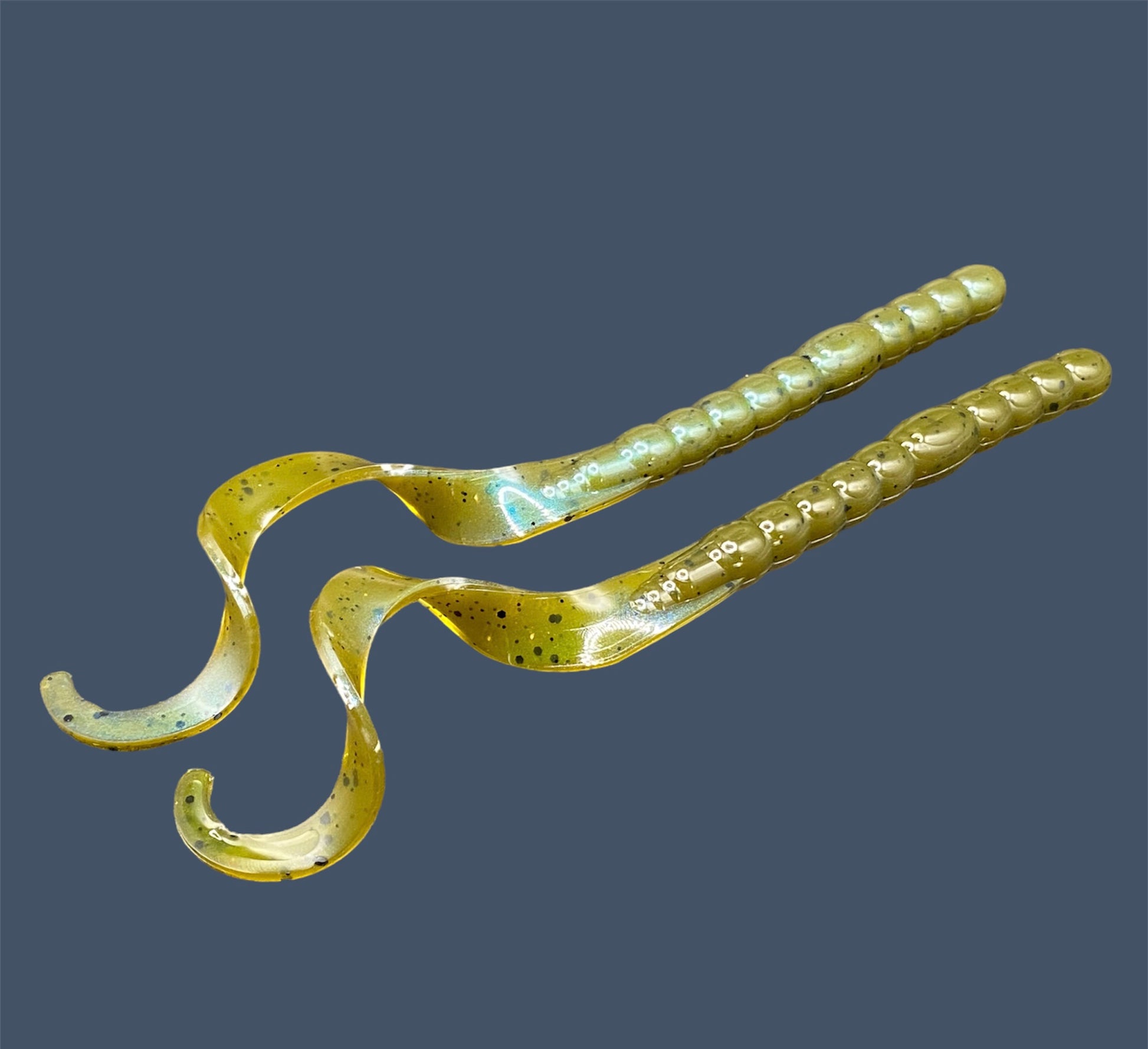 Soft plastic curly/ribbon 7.5-inch with realistic movement and versatile design for Texas and Carolina rigs. 7.5" Curl Tail Worm shown in Magic Craw (Green Pumpkin)