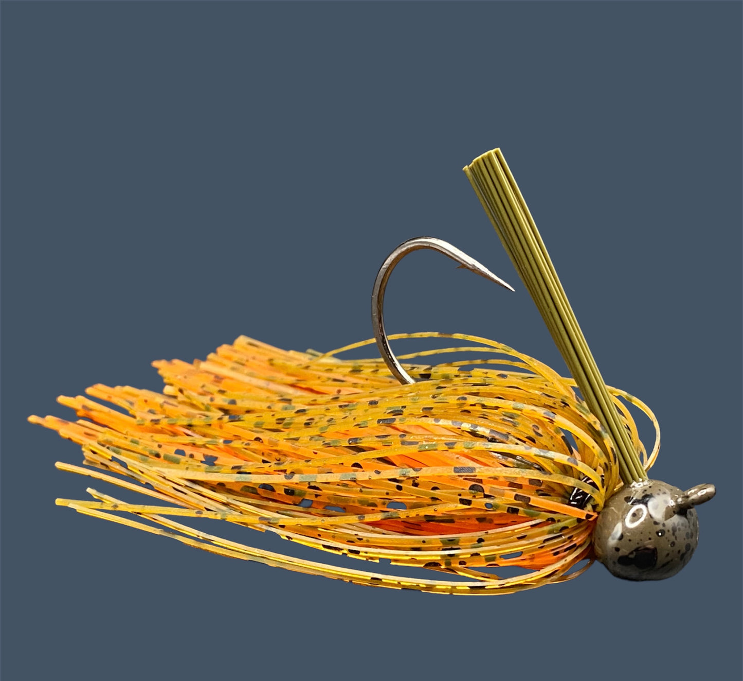 Football Jigs in Pumpkin Spice, highlighting the robust Mustad Heavy Wire hooks, integrated plastics keepers, and flaring 100% silicone skirts.