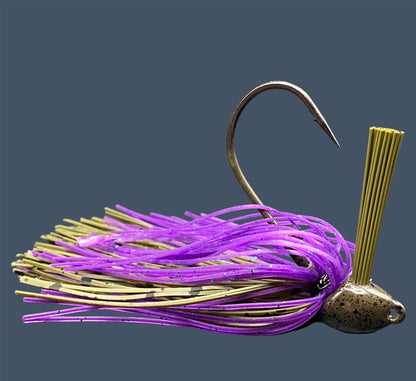 Flipping Jig in Swamp Juice (Green Pumpkin and Purple), showcasing the aggressive angled heads, Mustad Hook and fiber weed guards for effective fishing in diverse conditions.