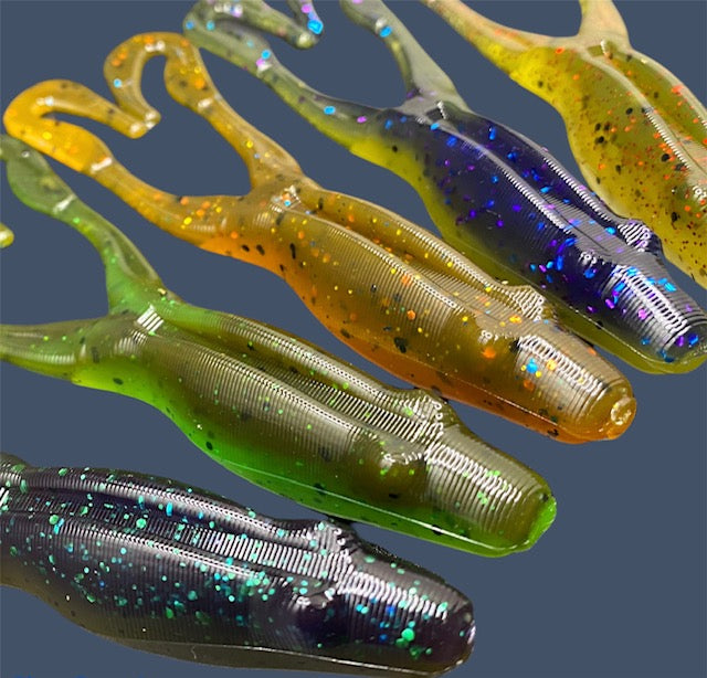 Tennessee Toad soft plastic frog bait with a weedless 4-inch robust body and long legs, designed for topwater and subsurface fishing, shown in various fish-catching colors